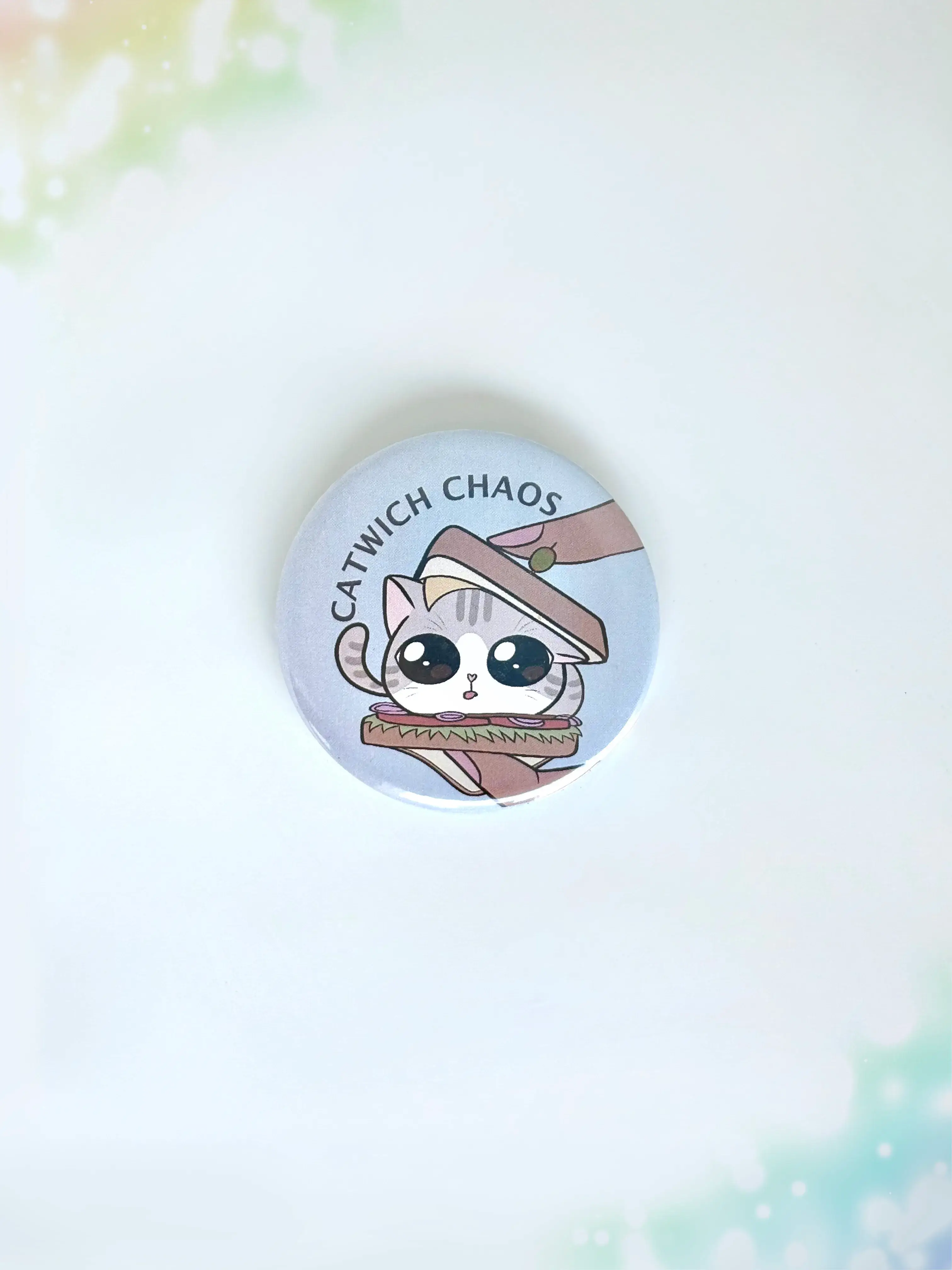 Chaos cat themed button badge featuring a funny cat-sandwich illustration and Catwich Chaos text.