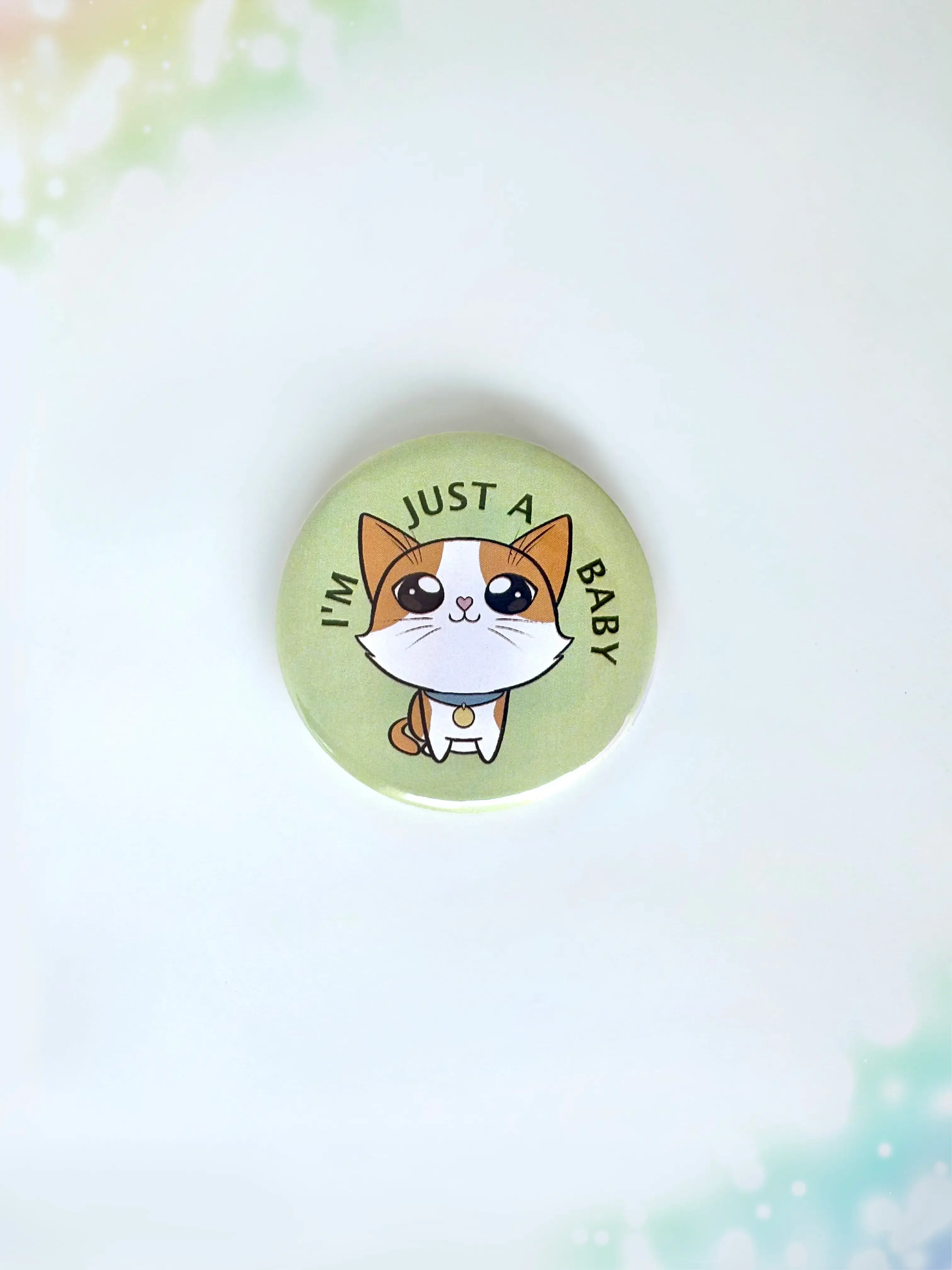 Adorable crying kitten aesthetic button badge with the text I'm Just A Baby.