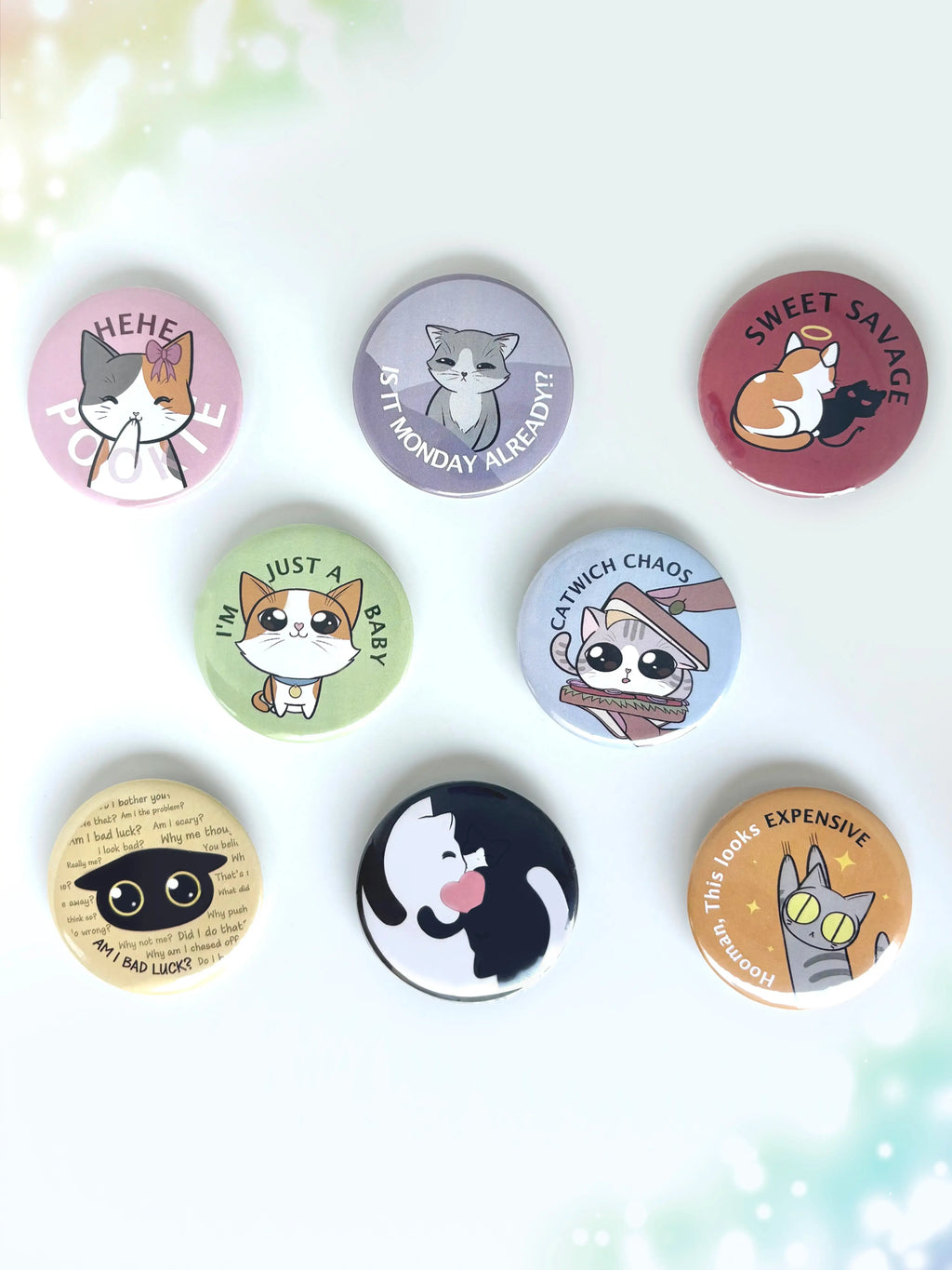A collection of cute cat button badges displayed together on a clean white background.