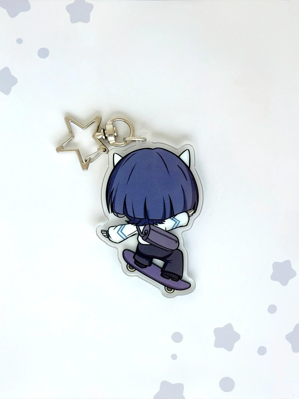 Back view of the Scaramouche anime keychain showcasing a unique alternate art illustration.