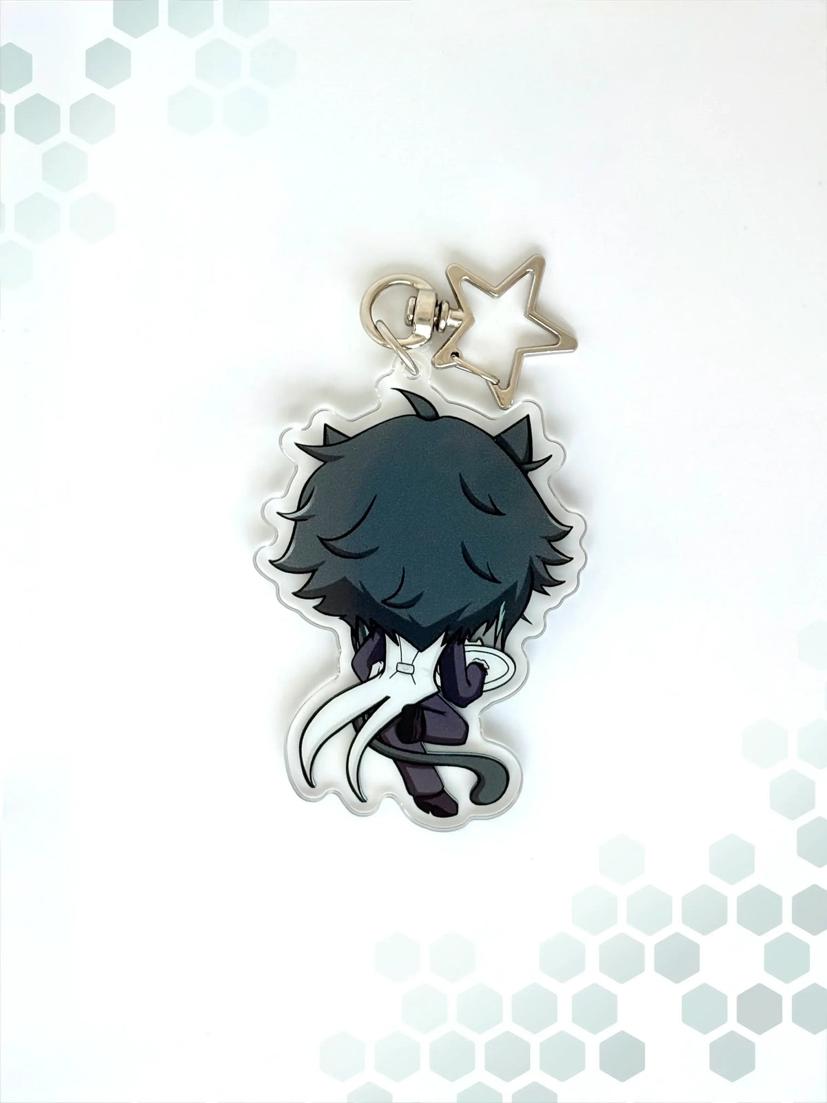 Back view of the Xiao anime keychain showcasing a unique alternate art illustration.